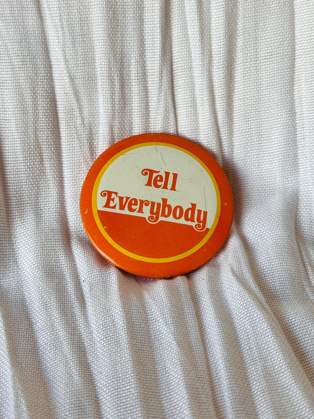 Vintage Orange ‘Tell Everybody’ Hippie Pin